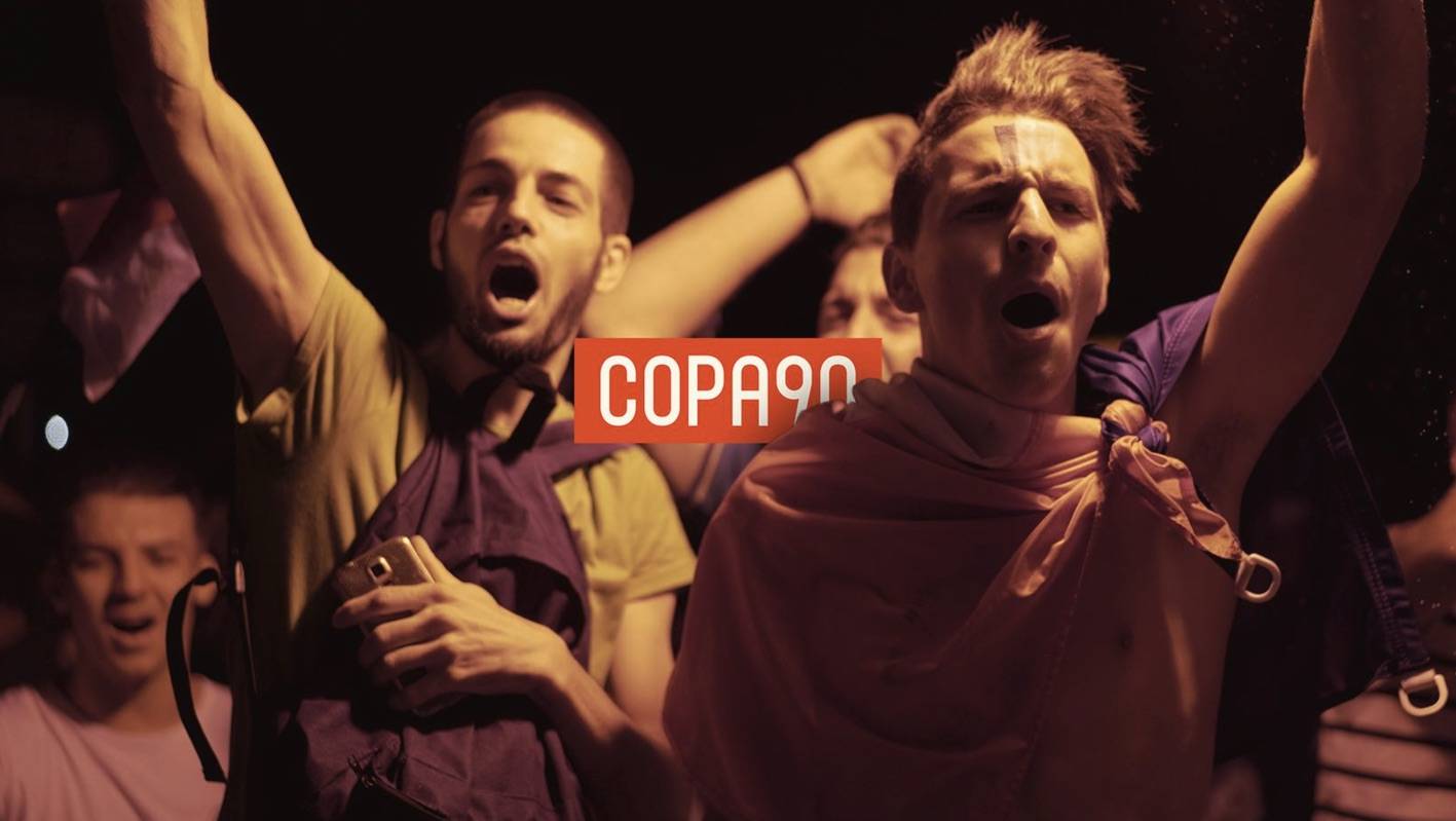 Copa 90 soccer fans Social video still image of tow soccer fans in a crowd with Copa90 logo overlaying it.