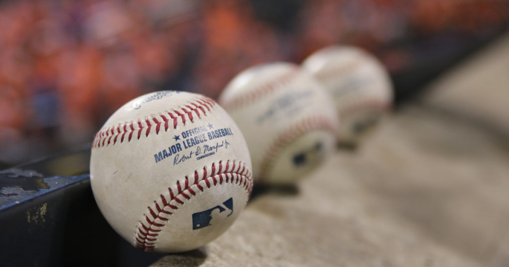 Row of official MLB baseballs. 