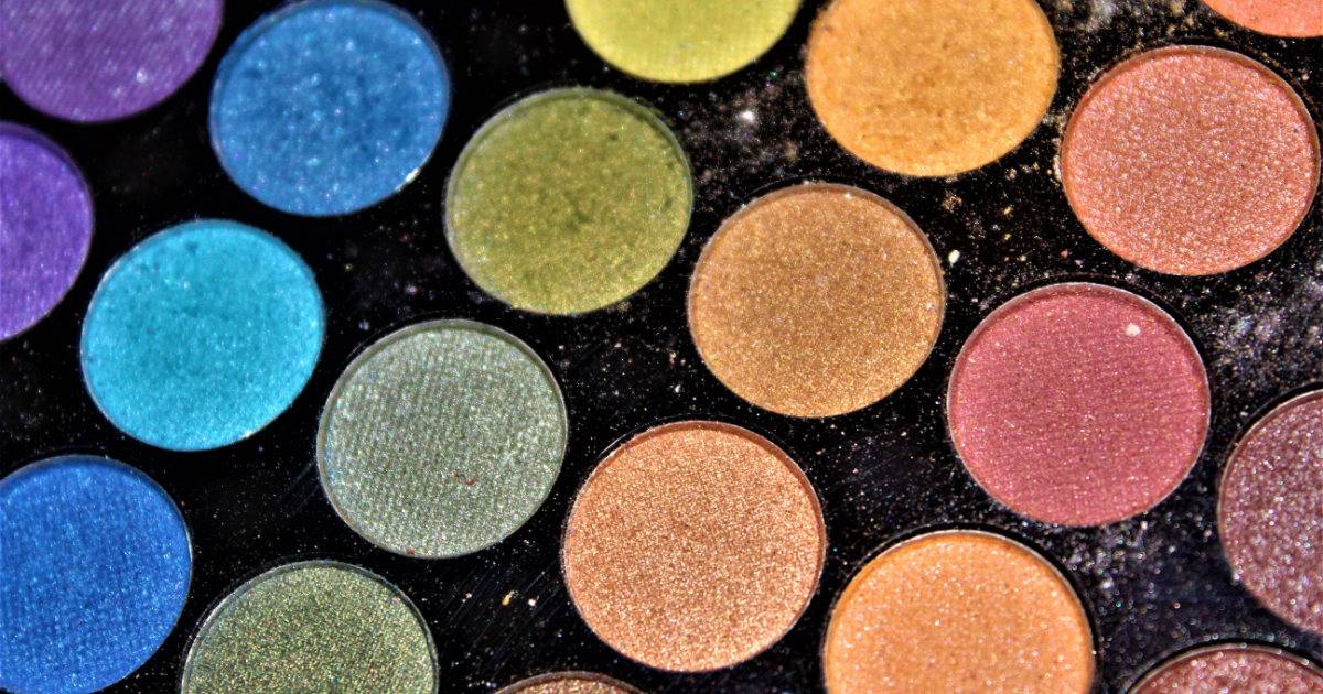 A colorful eye shadow palette from a beauty brand.