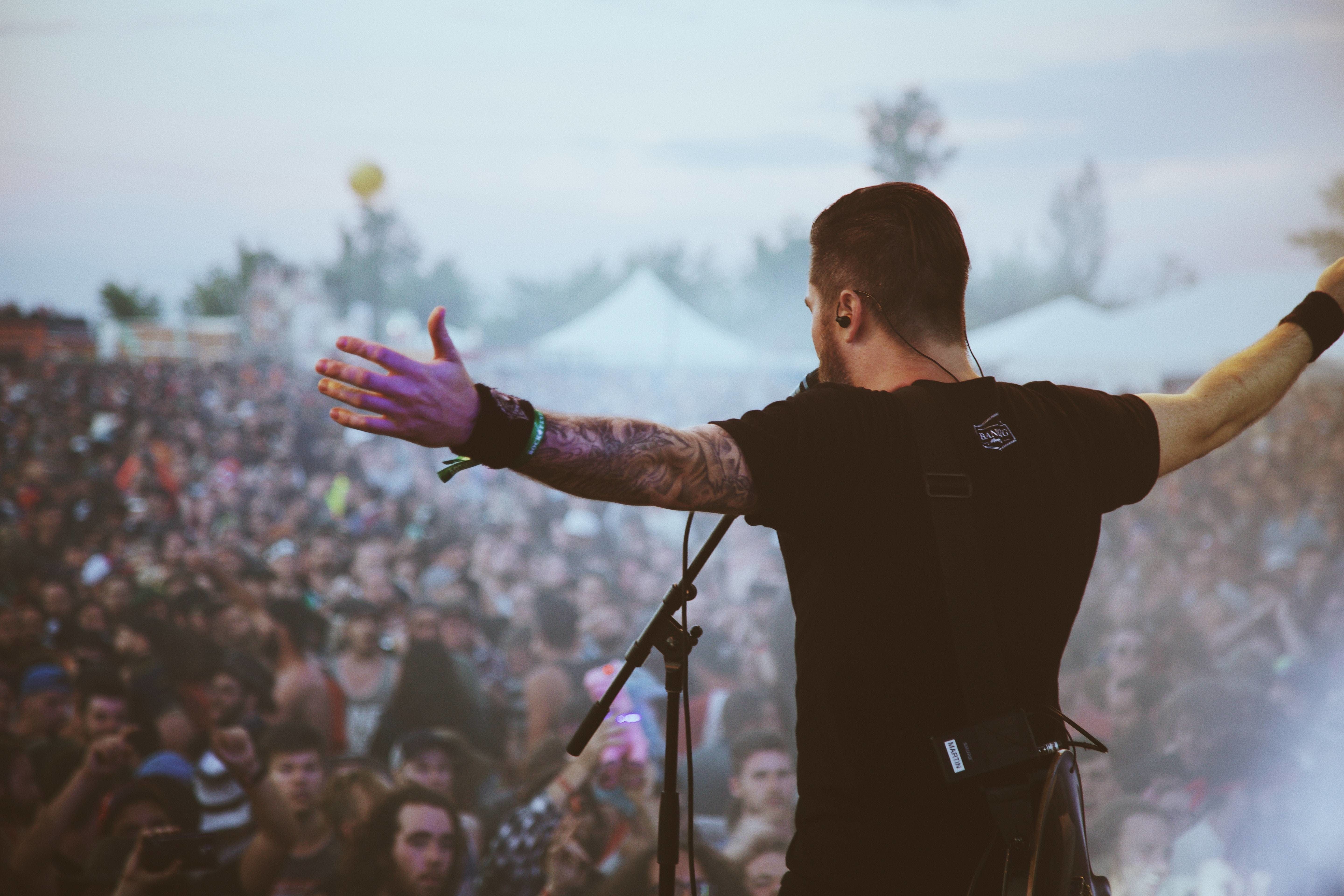 Behind the scenes video - a singer in front of concert crowd