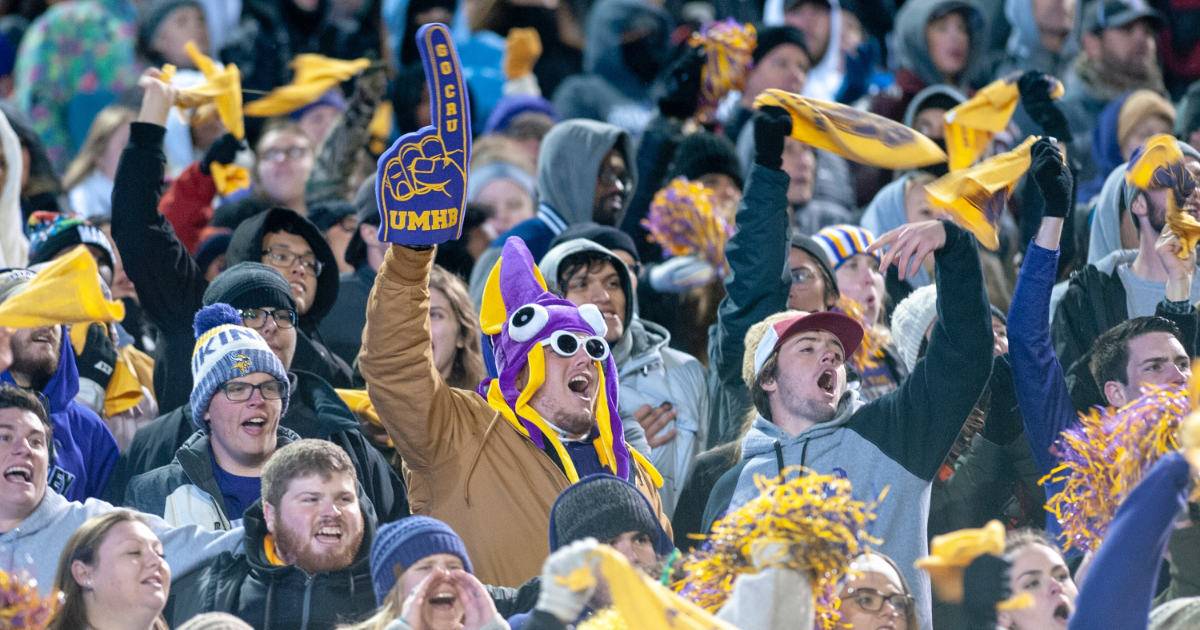 Cheering UMHB sports fans in crowd; engage gen z sports fans.