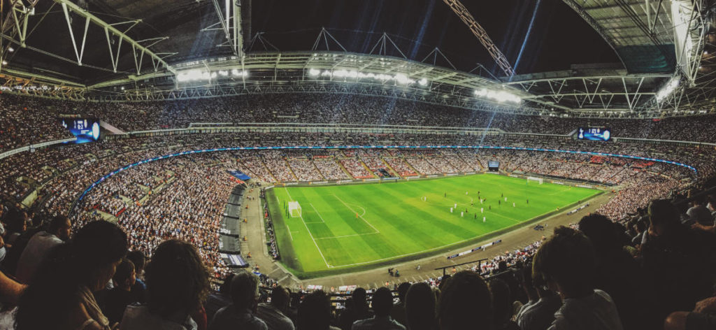examples of sports marketing featuring full fan attendance in a soccer stadium