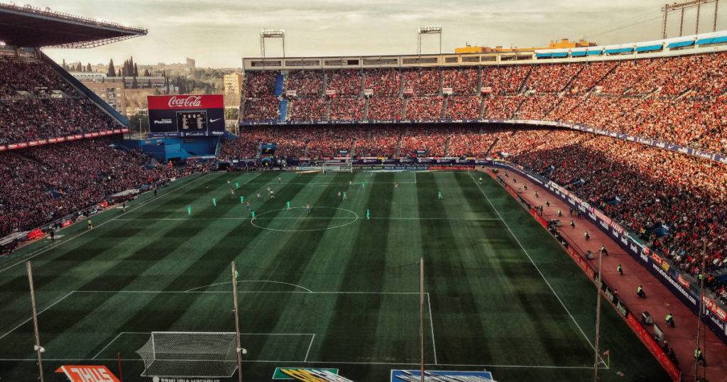 Engage more fans with social media - soccer stadium filled with fans