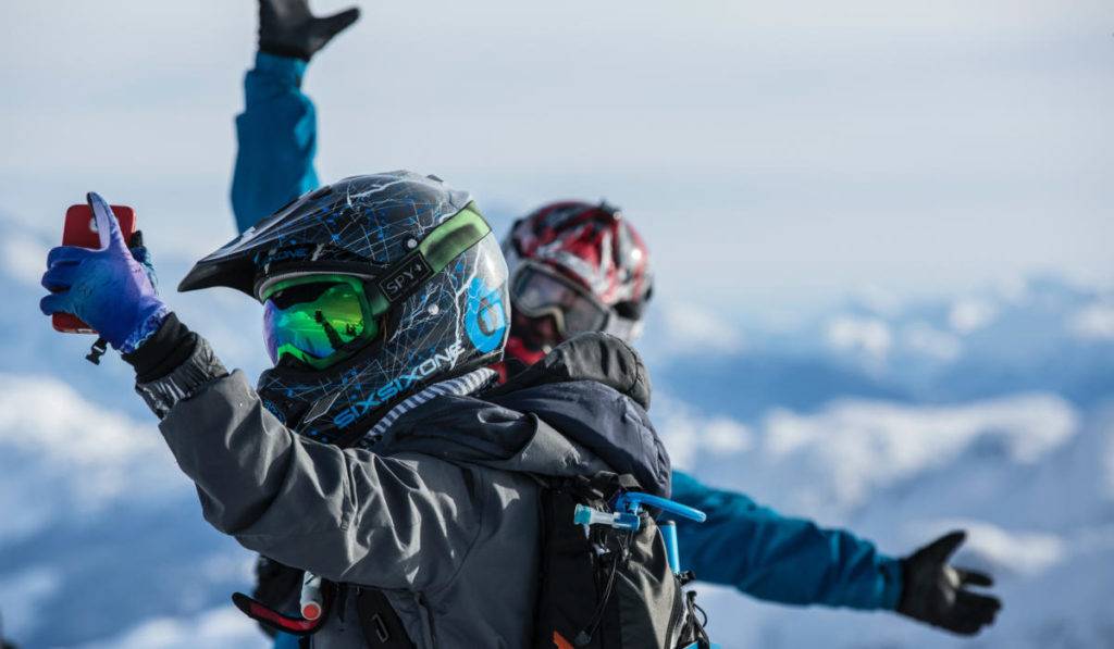 two snowboarders taking selfie for marketing campaigns