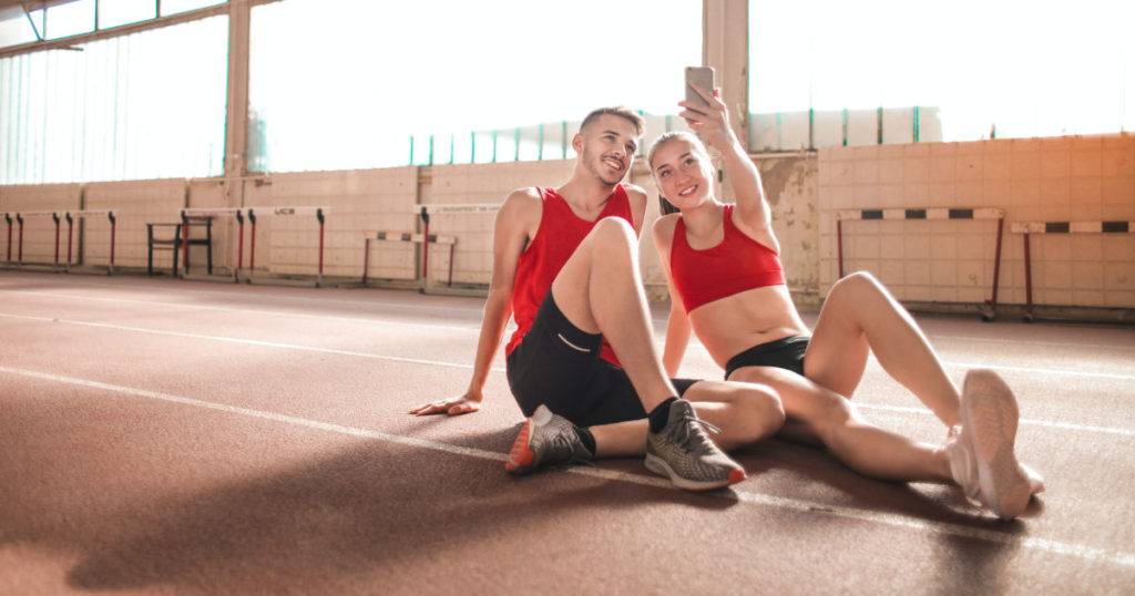 man and woman on track taking selfie as user generated content examples
