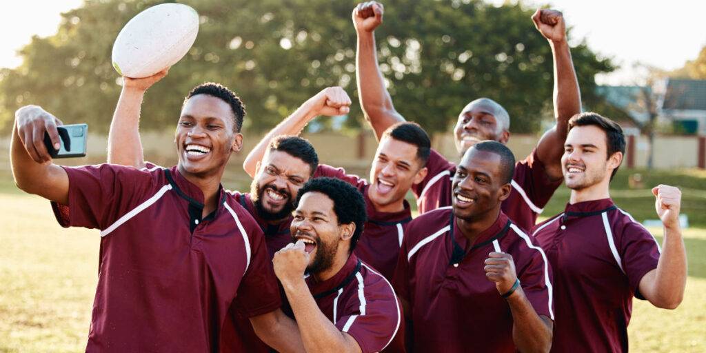 Behind-the-scenes content example, a rugby team celebrates. All-access content captured on mobile phone.