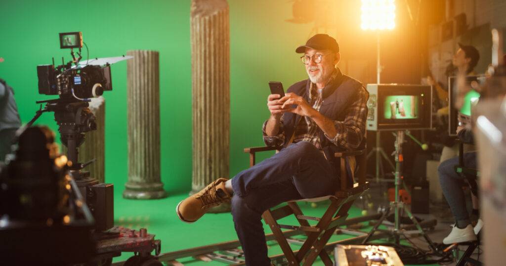Director on set with mobile phone for entertainment marketing